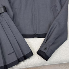 Spliced lapel jacket and belted pleated skirt suit