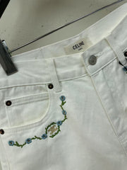 White denim shorts with embroidered letters