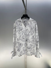 Bow print v-neck long sleeve shirt